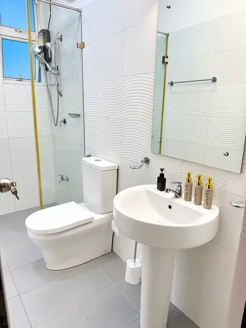 Bathroom with shower, basin and toilet