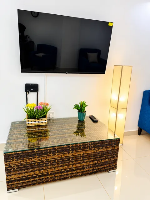 Wall-mounted Smart TV and console in the living room